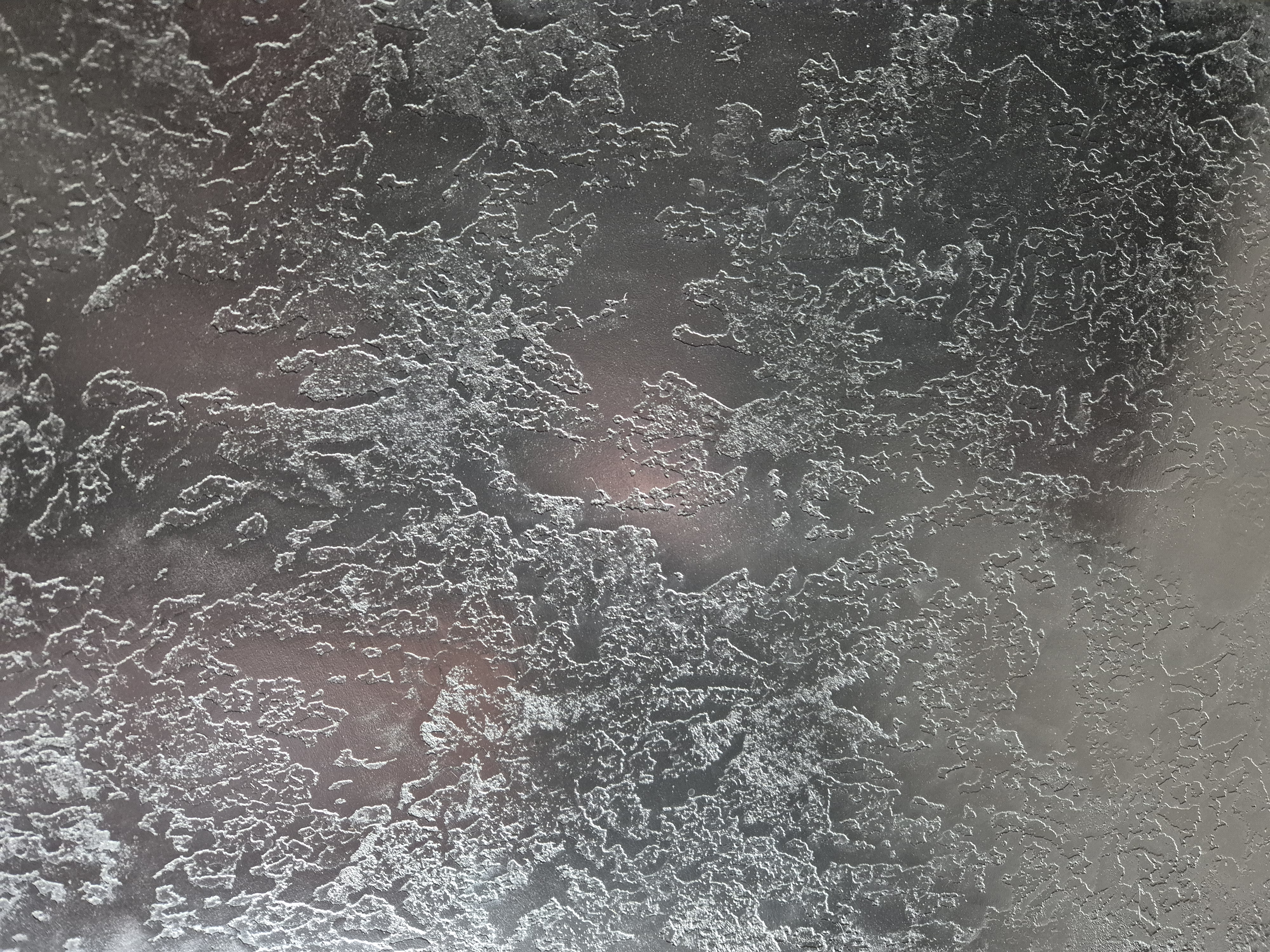 Dark grey venetian plaster with veining