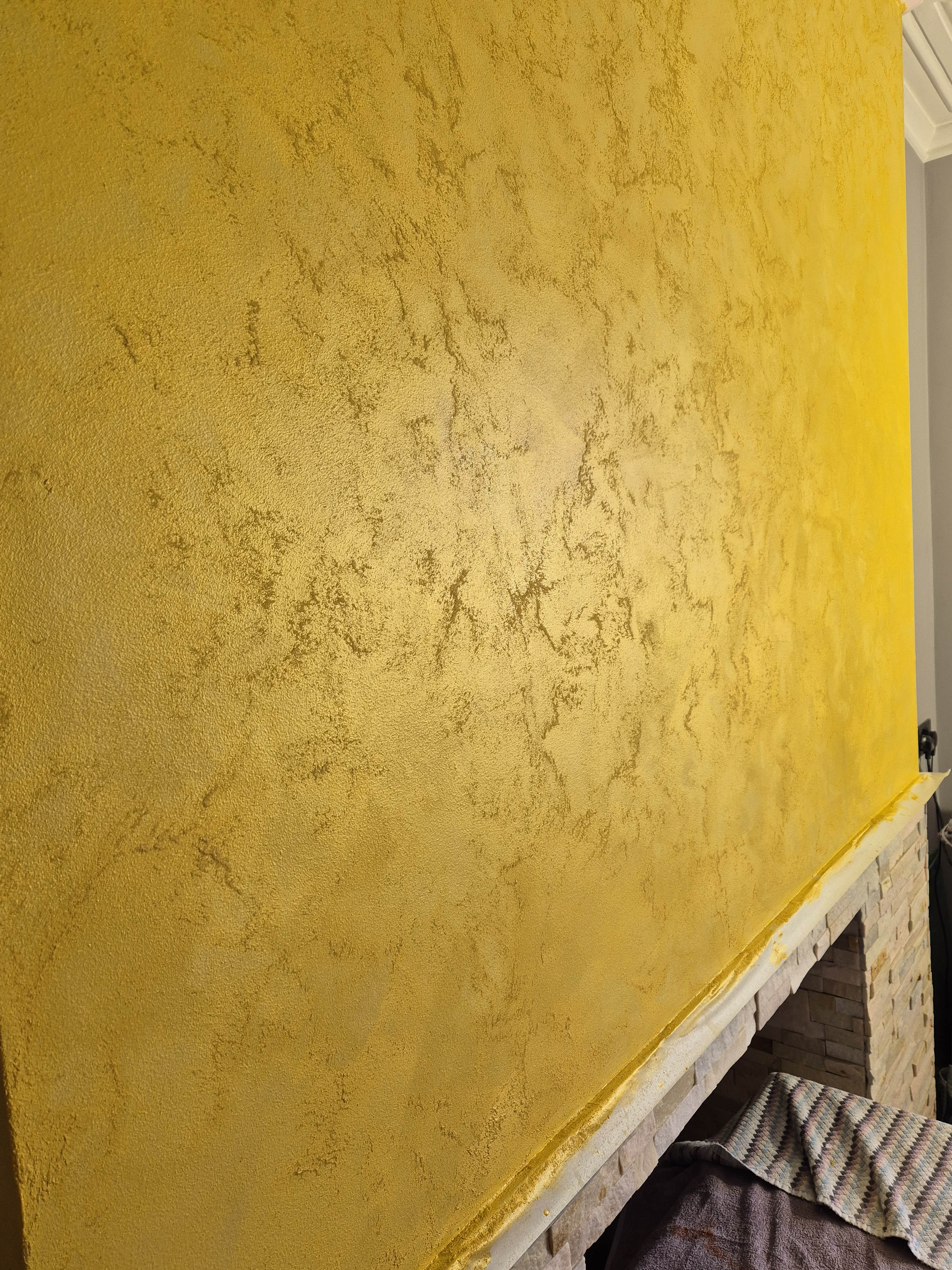 Gold venetian plaster feature wall